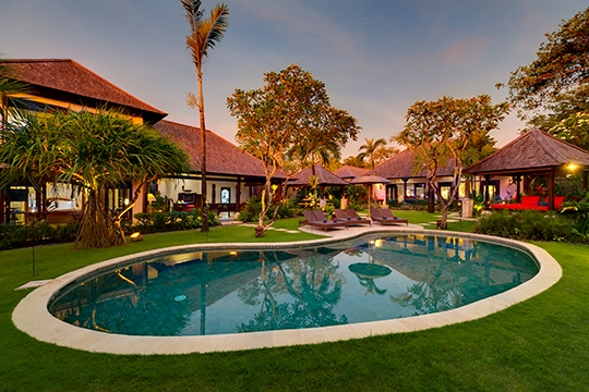 Pool and villa at sunset